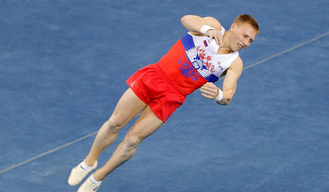 Денис Аблязин выступает в вольных упражнениях на чемпионате мира по спортивной гимнастике